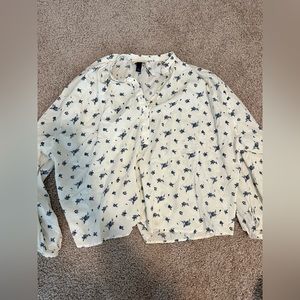 White blouse with blue flower pattern
